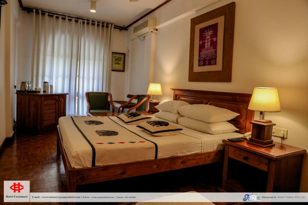 A cozy and inviting room at The Magnolia hotel in Shillong, showcasing modern amenities and beautiful decor.